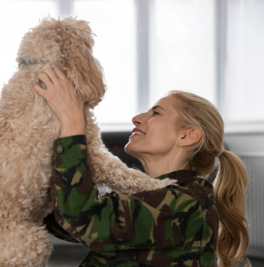 happy-woman-seeing-her-dog 1